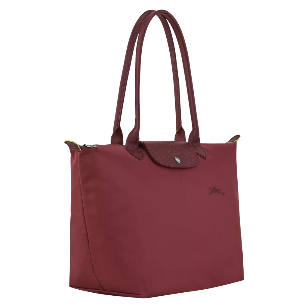 Longchamp Le Pliage Green L Tote Bag featuring a pomegranate design, showcasing its spacious fabric and sturdy handles.