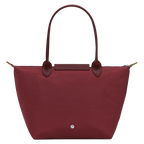 Longchamp Le Pliage Green M Tote Bag featuring a pomegranate design, shown with its sleek, foldable style and durable fabric.