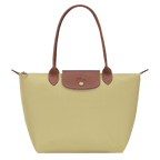 Longchamp Le Pliage Original M tote bag with beige nylon body and brown leather handles, showcasing its classic design.