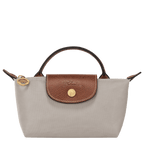 Longchamp Le Pliage Original Pouch with handle, stylish nylon bag with leather accents and a top zipper closure.