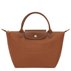 Longchamp Le Pliage Original S handbag in beige nylon with leather handles, folded open showing spacious interior and classic design.