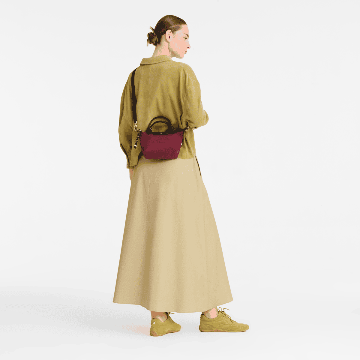 Longchamp Le Pliage Energy XS handbag in durable fabric with top handles and a sleek, compact design.