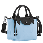 Longchamp Le Pliage Energy XS handbag in durable nylon with top handles and foldable design, shown in a sleek navy color.