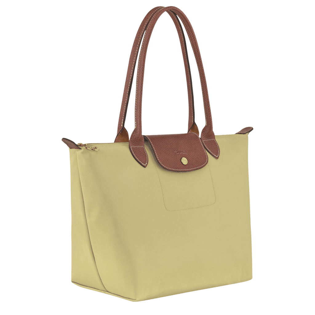 Longchamp Le Pliage Original M tote bag in beige fabric with leather handles, displayed flat on a white background.