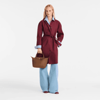 Longchamp Le Pliage Original S handbag in beige with foldable design and leather accents, displayed on a neutral background.
