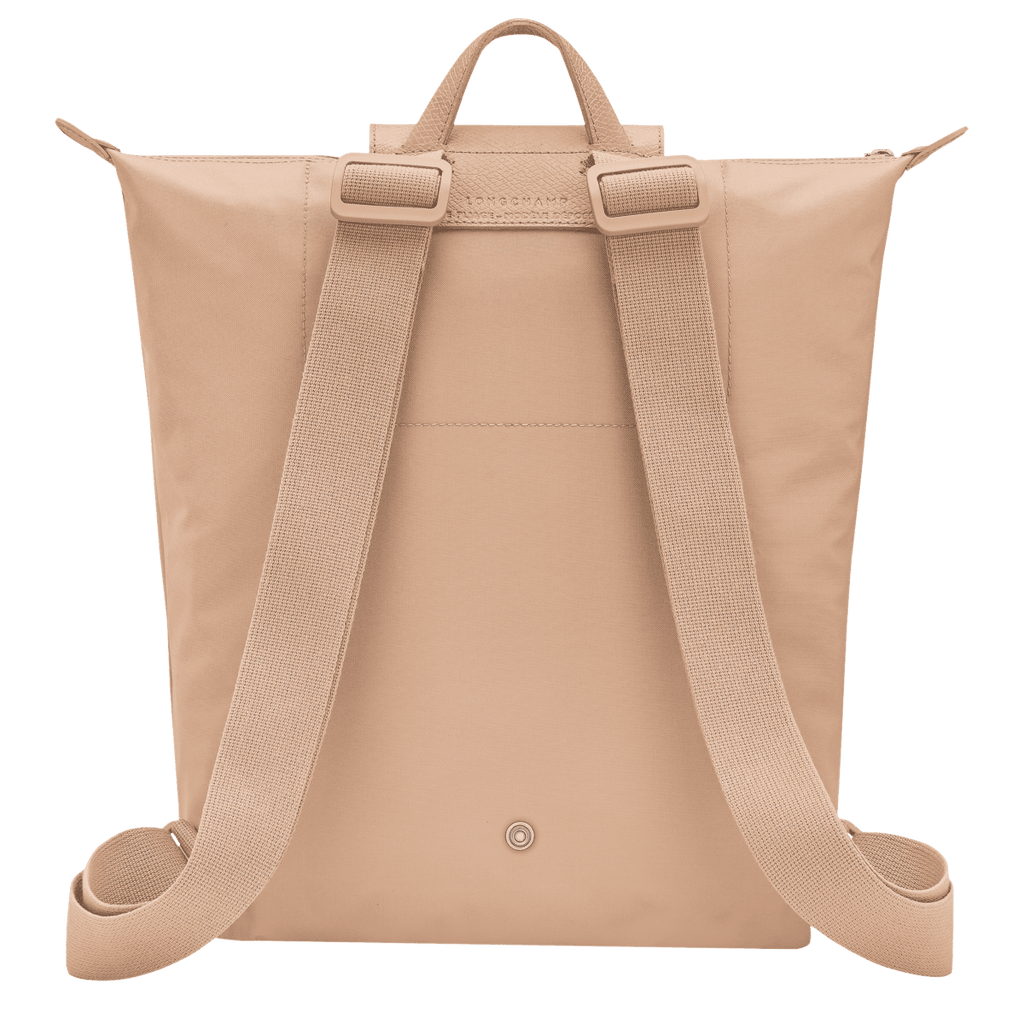 Longchamp Le Pliage One M backpack in beige, showcasing its compact, foldable design and durable nylon material.