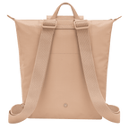 Longchamp Le Pliage One M backpack in beige, showcasing its compact, foldable design and durable nylon material.