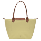 Longchamp Le Pliage Original M tote bag in beige nylon with leather handles, shown open with interior details visible.
