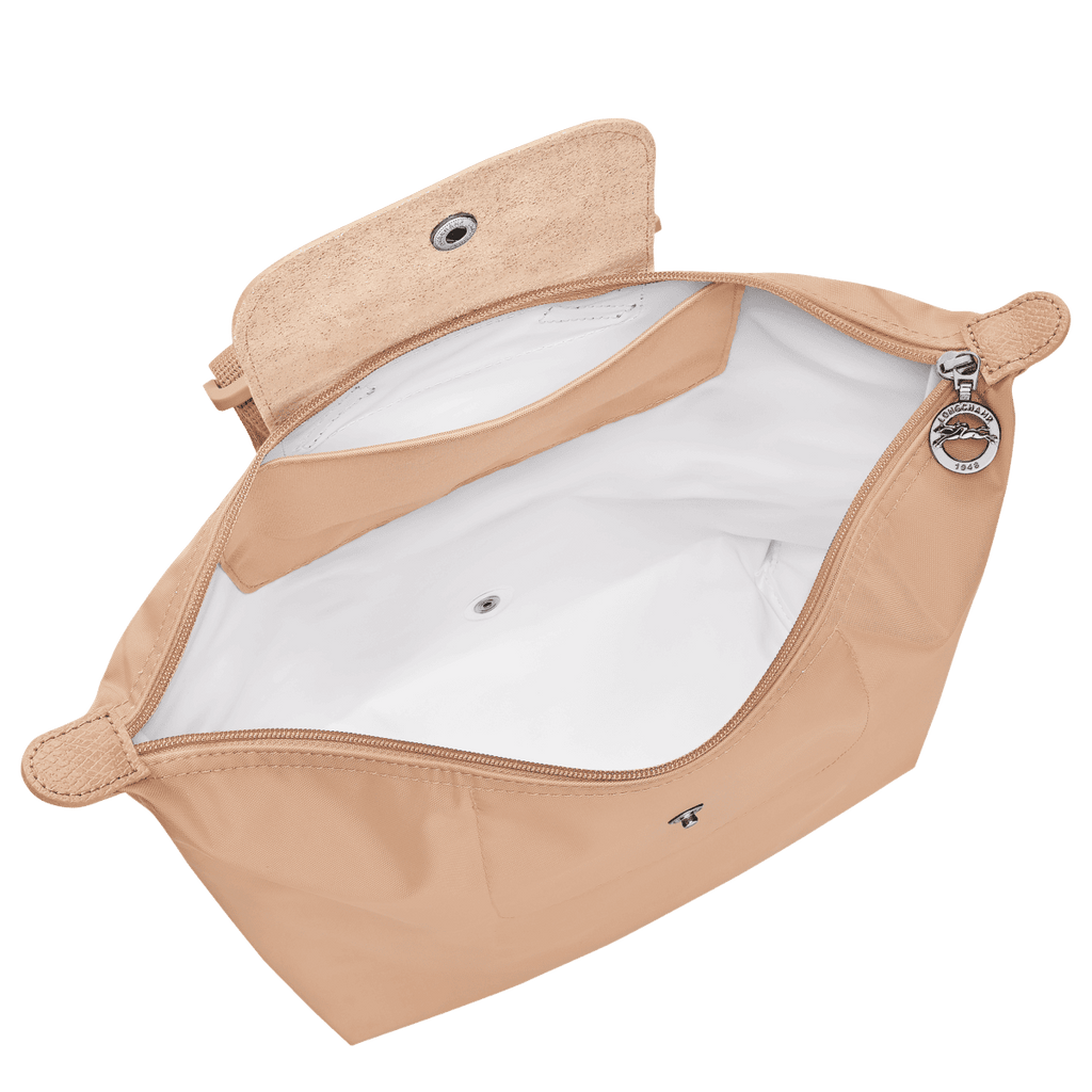 Longchamp Le Pliage One M backpack in beige with shoulder straps and front zipper pocket, stylish and functional bags for everyday use.