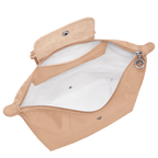 Longchamp Le Pliage One M backpack in beige with shoulder straps and front zipper pocket, stylish and functional bags for everyday use.