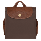 Longchamp Le Pliage Original M backpack in nylon with leather handles, shown in a side view with open top and strap details.