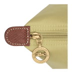 Longchamp Le Pliage Original M tote bag in beige with rolled handles and lightweight nylon material on a white background.