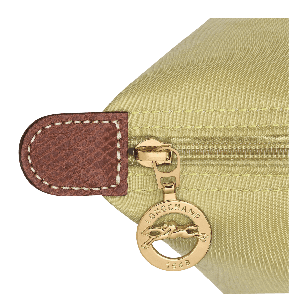 Longchamp Le Pliage Original M tote bag in beige with rolled handles and lightweight nylon material on a white background.