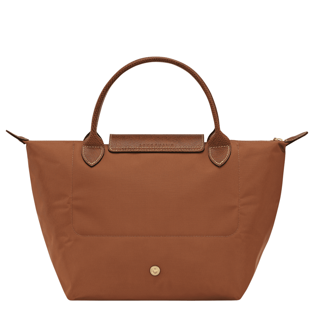 Longchamp Le Pliage Original S handbag with beige nylon exterior and leather handles, showing its compact, foldable design.