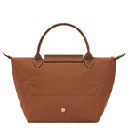 Longchamp Le Pliage Original S handbag with beige nylon exterior and leather handles, showing its compact, foldable design.