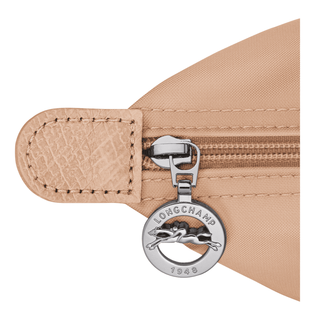 Longchamp Le Pliage One M backpack in durable nylon with leather handles, shown in a sleek, compact design.