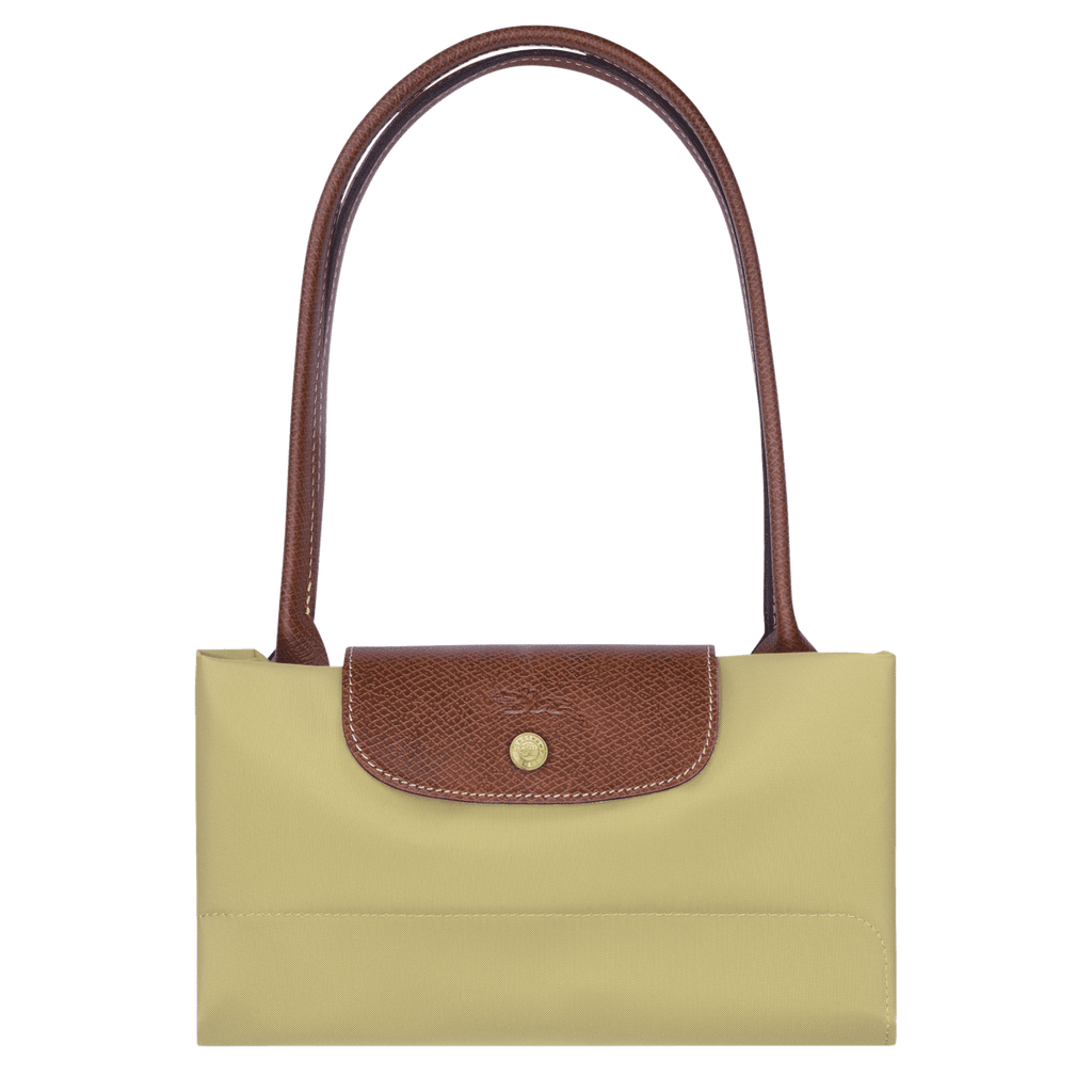 Longchamp Le Pliage Original M tote bag in beige fabric with leather handles, showcasing its classic foldable design.