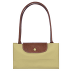 Longchamp Le Pliage Original M tote bag in beige fabric with leather handles, showcasing its classic foldable design.