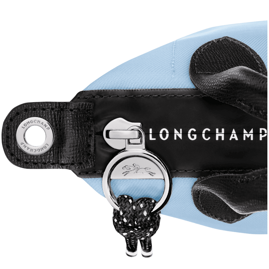 Longchamp Le Pliage Energy XS handbag in lightweight, durable nylon with tan leather accents and top handles.